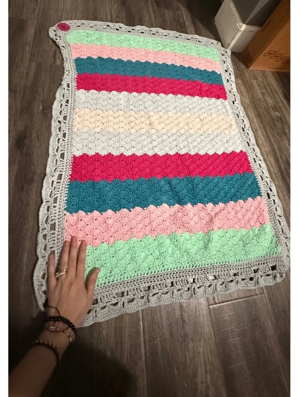 Handmade baby blanket signed by crafter with logo